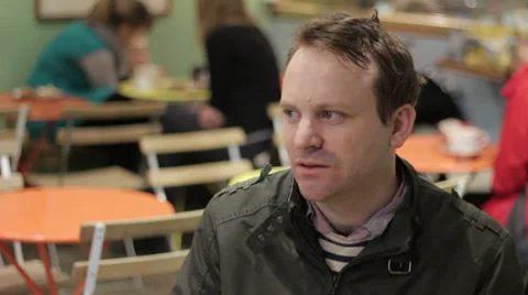 Man drinks coffee in cafe CU 库存影片 35191551