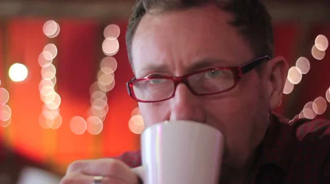 Man drinks coffee in cafe Stock Footage 34344007