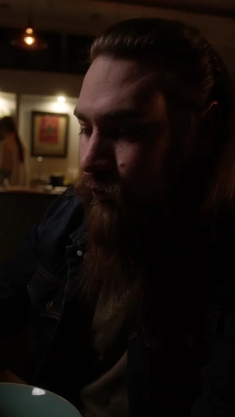 A man drinks coffee in a cafe Stock Footage 223880785