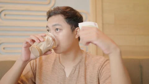 A man drinks coffee, counts a lot of money and has financial freedom. Stock Footage 252071592