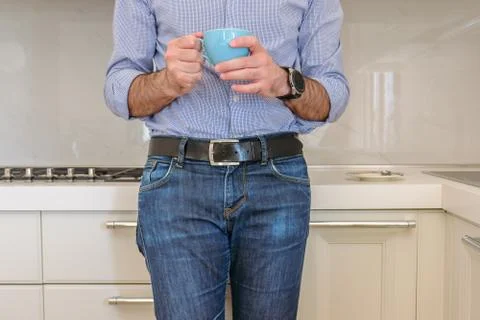 Man drinks a coffee in the kitchen Stock Photos