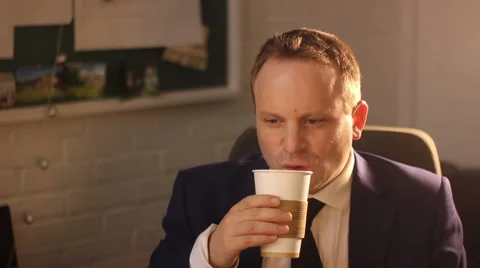 Man drinks coffee in office Stock Footage 61955129