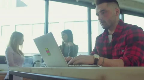 Man drinks coffee while working in the startup office Stock Footage 62948610
