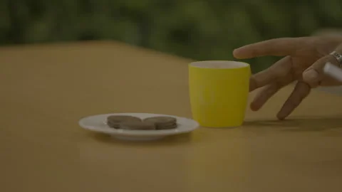 A man drinks coffee in a yellow cup in an office cafeteria Stock Footage 284005625