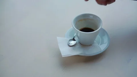 Man drinks delicious espresso from small white cup closeup Stock Footage 120589398