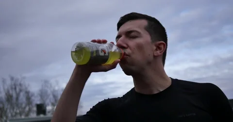 Man Drinks Electrolytes after Workout Stock Footage 232788938