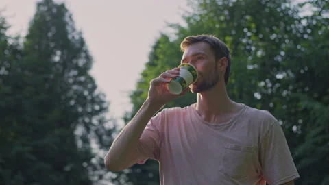 A man drinks from a glass Stock Footage 156407351