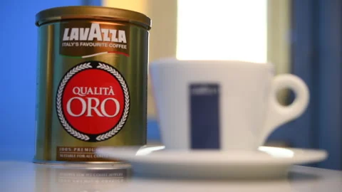 A man drinks Lavazza coffee in a cafe. Stock Footage 302826285