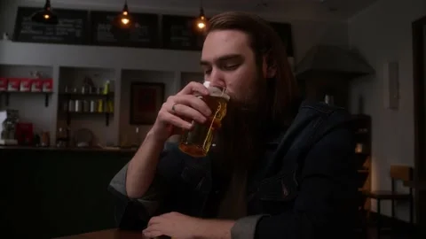 A man drinks light beer Stock Footage 223880959