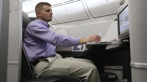 Man Drinks on Plane 4K Stock Footage 89291811