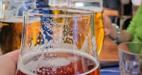 Man drinks red double malt beer with friends in an english pub Stock Footage 267959404