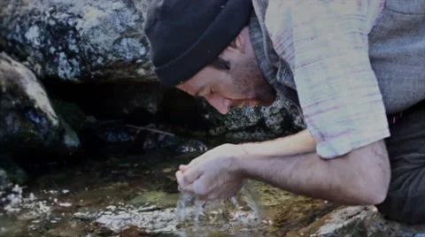 Man drinks river water Stock-Footage 41935269