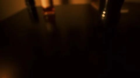 Man drinks rum or whiskey with cola alone at home. Warm dim lighting, quiet Video stock 311450127