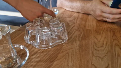 A man drinks tea and uses a mobile phone app for online business communication. Stock Footage 243168379