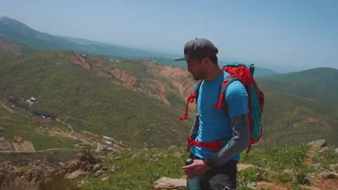A man drinks tea in the mountains Stock Footage 299583573