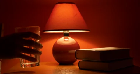Man drinks water from bedside table Stock Footage 166899796
