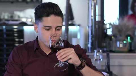 Man drinks wine at the restaurant Stock Footage 251117863