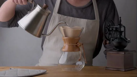 Man dripping coffee with carafe Stock Footage 143126947