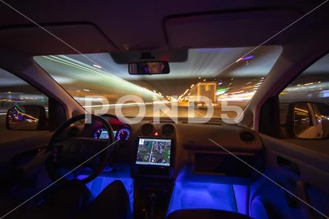 The man drive car in the city road. Evening night time Stock Photos