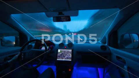 The man drive a car on the evening highway. Inside view. Wide angle Stock Photos