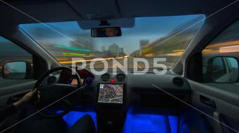 The man drive a car on the evening road. Inside view. Wide angle Stock Photos