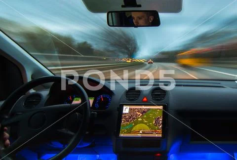 The man drive a car on the highway. Inside view Stock Photos