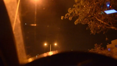 The man drive the car inside view, control panel, wheel, close up. Evening-night Video stock 99485825