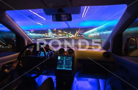 The man drive car in the night city. Wide angle Stock Photos