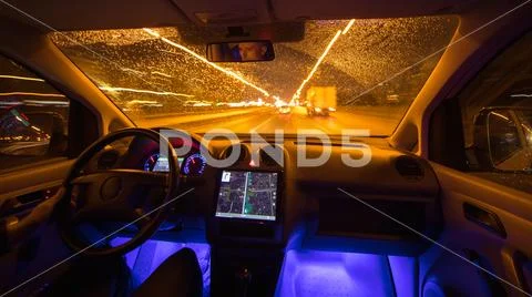The man drive car in the night city. Wide angle Stock Photos