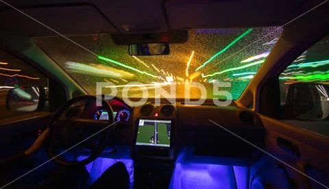 The man drive car in the rainy city. Evening night time Stock Photos
