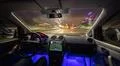 The man drive car in the rainy city. Evening night time Photo
