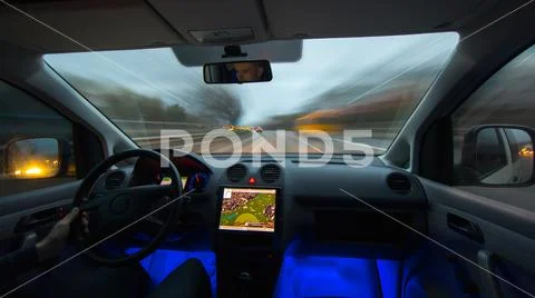 The man drive a car on the road. Inside view. Wide angle Stock Photos