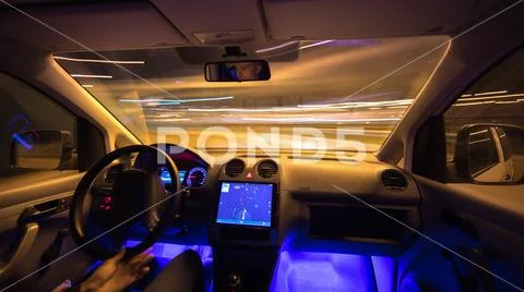 The man drive in the city road with navigation. Evening night time Stock Photos