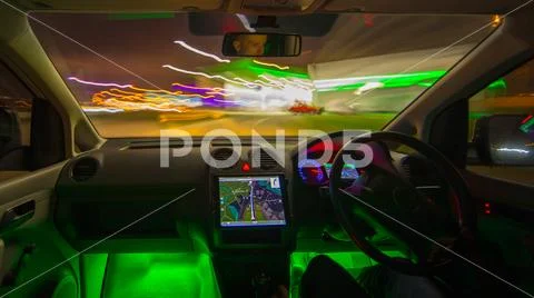The man drive to a gas station. Evening night time. Left side traffic Stock Photos