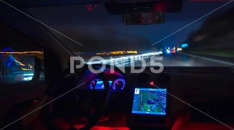 The man drive on the highway. Evening night time. Inside view Stock Photos