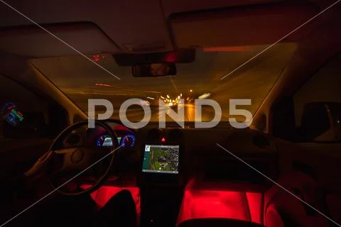 The man drive on the highway. Evening night time. Inside view Stock Photos