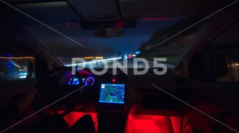 The man drive on the highway. Evening night time. Inside view Stock Photos