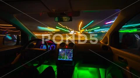 The man drive in the highway with a navigation. Evening night time. Wide angl Stock Photos