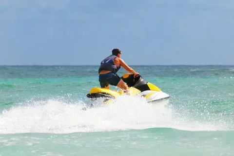 Man drive on the jetski Stock Photos