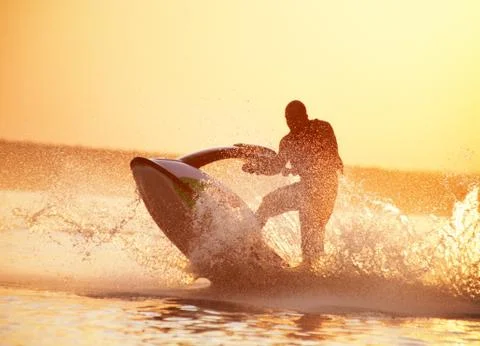 Man drive on the jetski Stock Photos