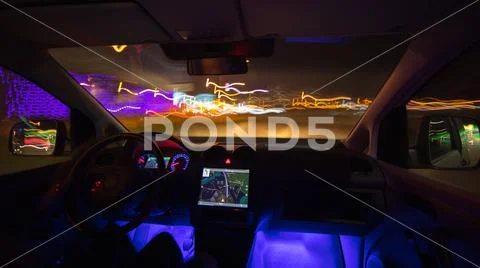 The man drive with navigation in the city road. Evening night time Stock Photos