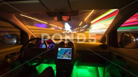 The man drive on the night highway. Inside view. Wide angle Stock Photos