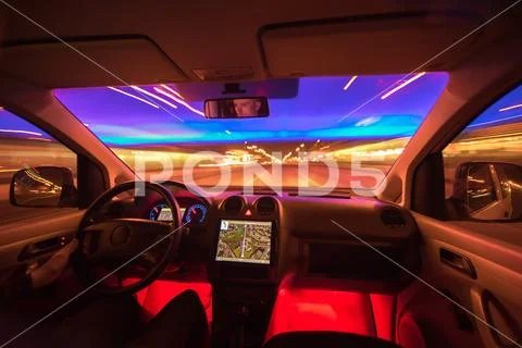 The man drive on the night highway. Inside view. Wide angle Stock Photos