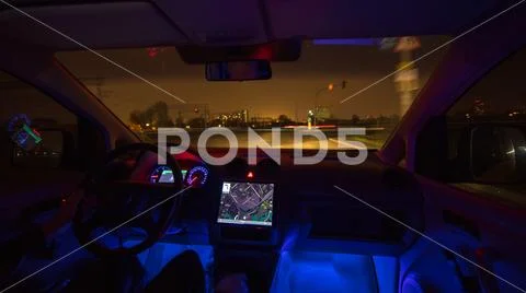 The man drive on the rainy highway. Evening night time. Inside view Stock Photos