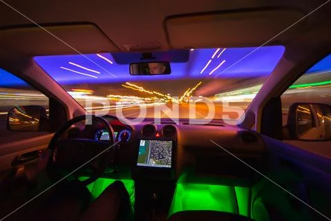 The man drive in the road with a navigation. Evening night time. Wide angle Stock Photos