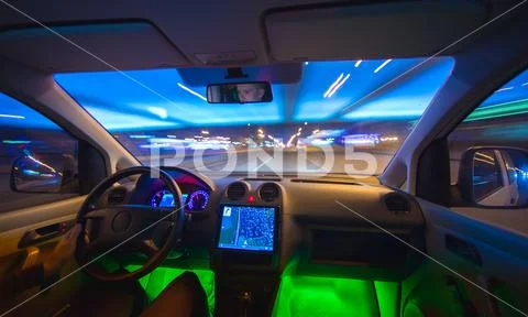 The man drive in the road with a navigation. Evening night time. Wide angle Stock Photos