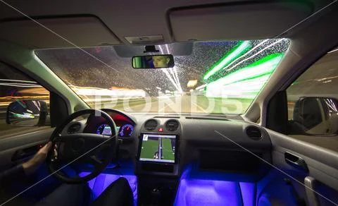 The man drive vehicle in the city highway. Evening night time Stock Photos