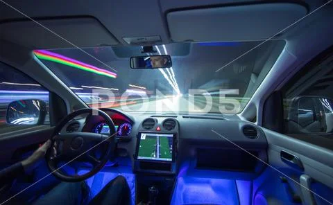 The man drive vehicle in the city road. Evening night time Stock Photos
