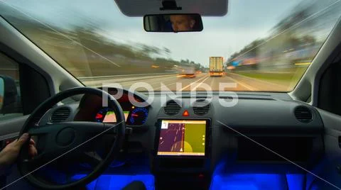 The man drive a vehicle on the highway. Inside view Stock Photos