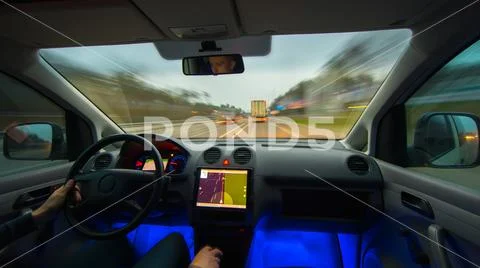 The man drive a vehicle on the highway. Inside view. Wide angle Stock Photos